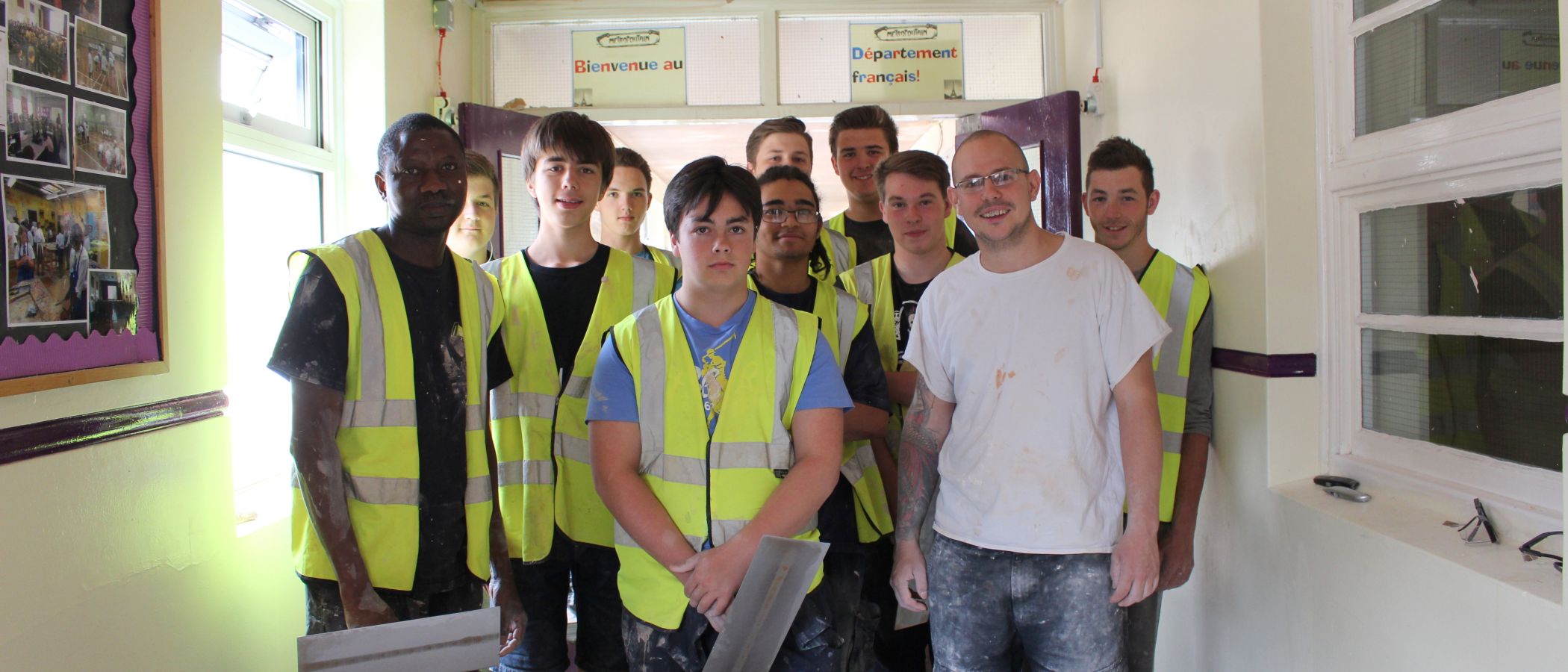 Dave bayley white t shirt with trainee plasterers