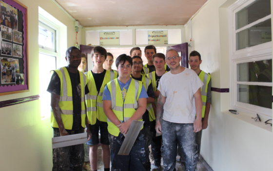 Dave bayley white t shirt with trainee plasterers