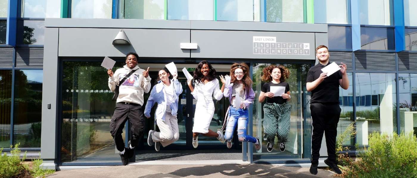 East London Institute of Technology BTEC students receiving their results JUMPING SHOT