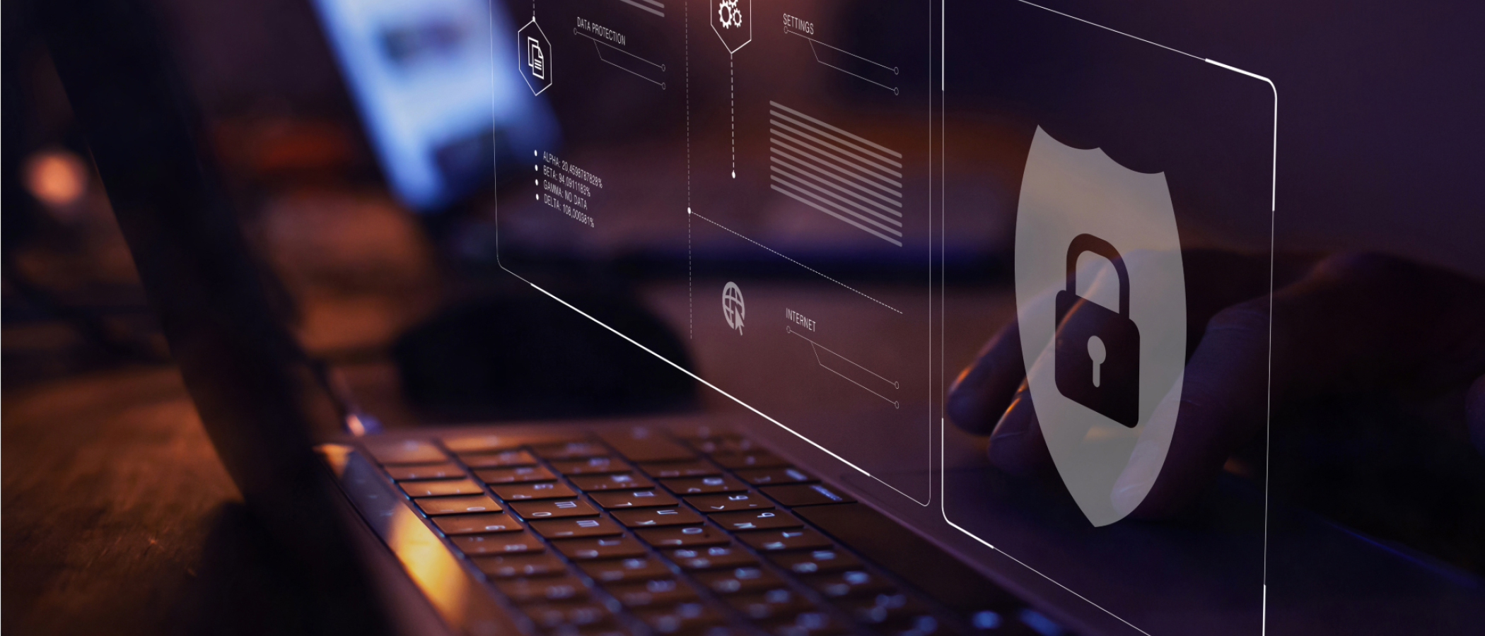 A laptop keyboard with a digital padlock and security shield overlay, representing data protection, cybersecurity and GDPR compliance.