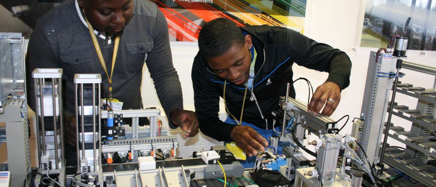 Hnd engineering students working with a siemens plc