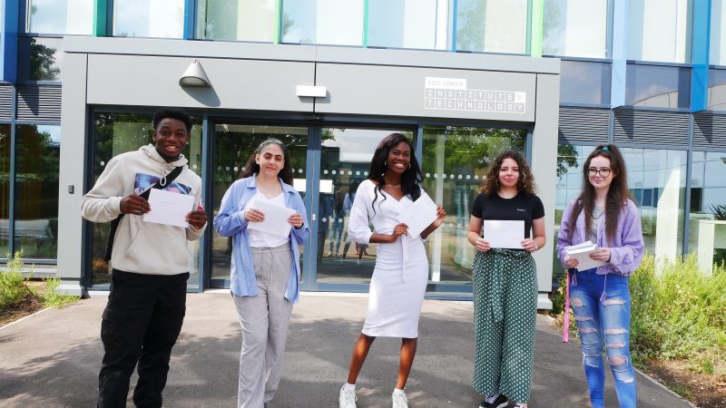 East London Institute of Technology BTEC students receiving their results Standing
