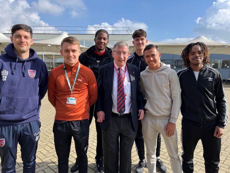 Steve Thompson MBE MD of Dagenham and Redbridge FC with Barking Dagenham College Apprentices