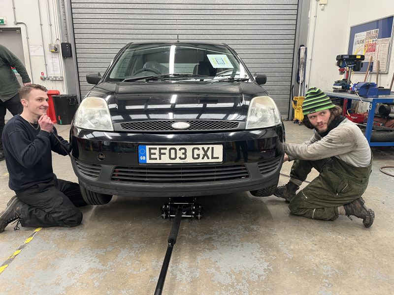 Motor vehicles apprentice Connor Johnson left Wheel Change Challenge at Barking Dagenham College