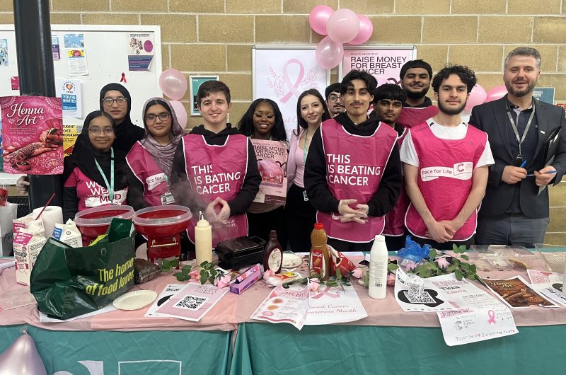 Business students with their tutor Dilon Beqa who raised 350 Cancer Research UK