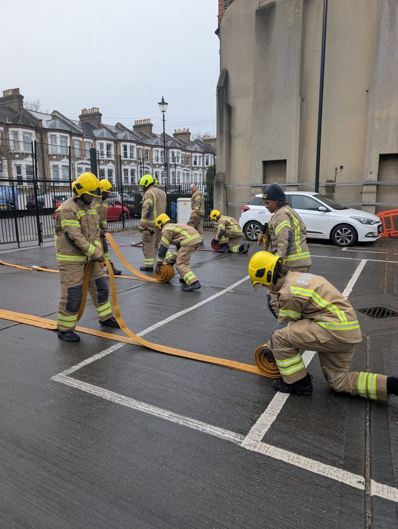 Barking Dagenham College Protective Services students at New Cross Fire Station during hose challenge