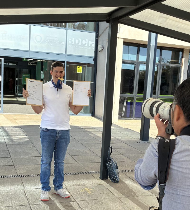 Barking Dagenham College student Harvey Mc Laughlin celebrates receiving Merit for his Engineering T Level 13th August 2026 being photographed by national press