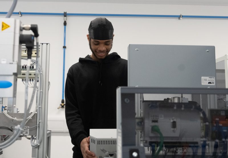 Daivam Djassi BTEC Engineering student at Barking Dagenham College in one of the Industry 4 0 labs which will be used in the World Skills competitions