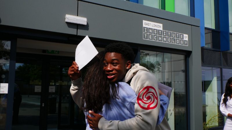 East London Institute of Technology BTEC student Demar Bellamy Foster right hugs fellow BTEC student Jasmine Mustafa after receiving their results