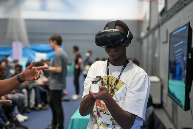 Students learn about cyber careers VR Headset Taser Challenge