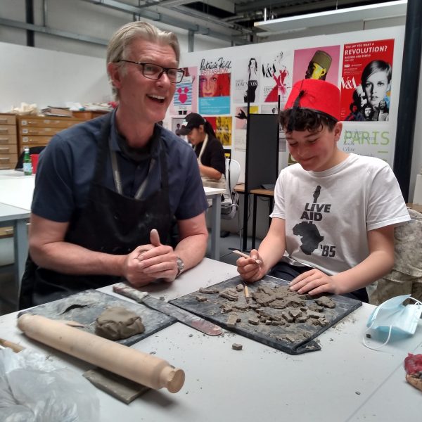 Saturday Club members learning and playing with ceramics