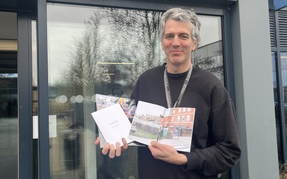 David Bennett with his new photobook outside Barking Dagenham College