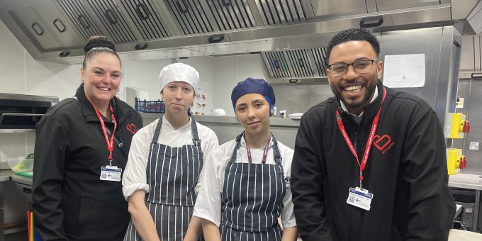 Hospitality students Amy Harvey and Chloe Gain with judges Lisa Morris and Fabio Jesus from BD Group