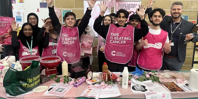 Business students with their tutor Dilon Beqa who raised 350 Cancer Research UK 2