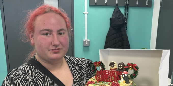 Kiera with the Christmas cake she baked for her classmates