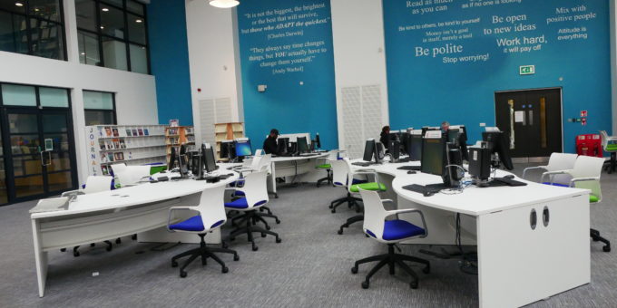 Desks, chairs and computers in the Learning Resource Centre (LRC) at the Rush Green Campus